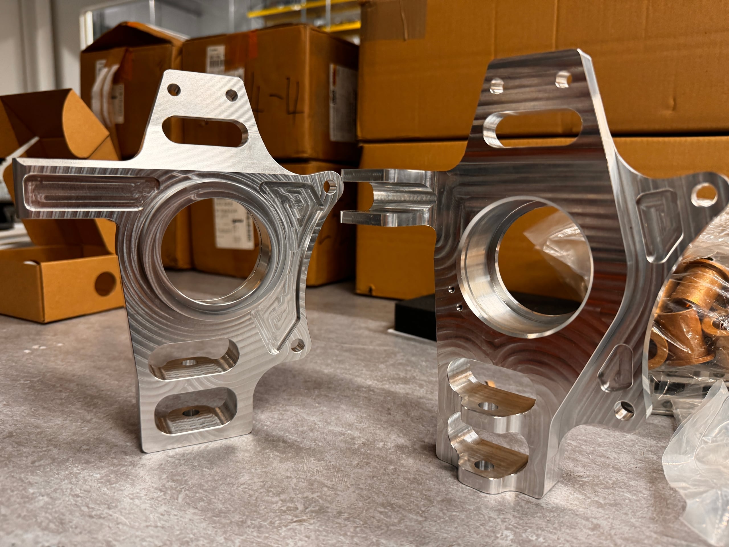 Finished FSAE EV7 front uprights — both primary and spare sets in 6082-T6 aluminum, all tolerances verified and signed off for vehicle integration