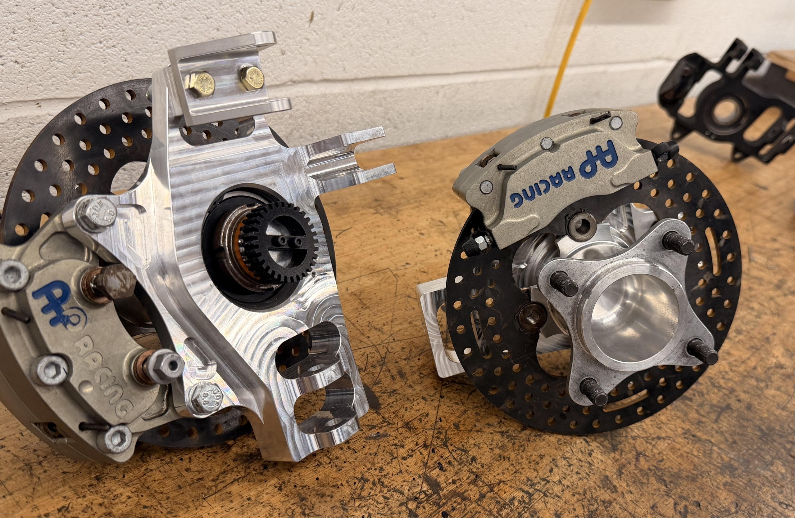 FSAE EV7 front upright — finished 6082-T6 aluminum part after 5-axis CNC machining at Dexory